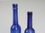 Collection of '15' Cobalt Blue Caster Oil Hand Blown Bottles Made in 1800s, United Kingdom Tall 2 bottles top view