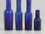Collection of '15' Cobalt Blue Caster Oil Hand Blown Bottles Made in 1800s, United Kingdom 4 heights top view down
