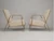 Gilded Metal Faux Bamboo Upholstered Lounge Chairs in the Maison Jansen Style.