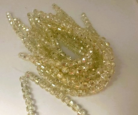 Chinese Glass Cathedral Beads in Pale Lemon. 7x7.5mm.