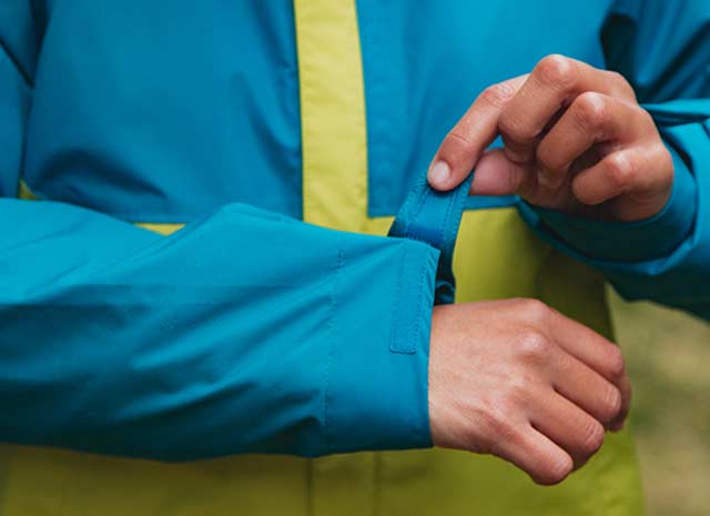 A Handsome Young Man Casually Dressed In A Blue Puffer Jacket With A Whit  Hoodie Makes An Interesting Gesture With His Hand A Teenage Boy With Short  Cropped Hair In A Crew