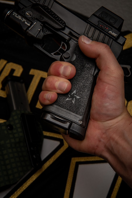 Hand holding Staccato CS 15rd Gen3 V3 grip module – textured pistol grip upgrade for compact carry
