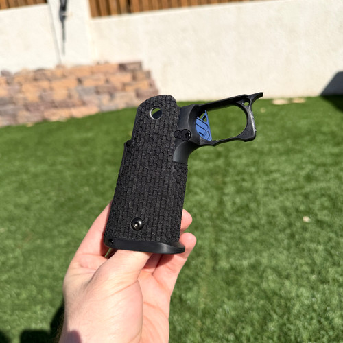 Tree Bark texture on this STI 2011 black grip module featuring our Extreme Tempest Blue trigger.