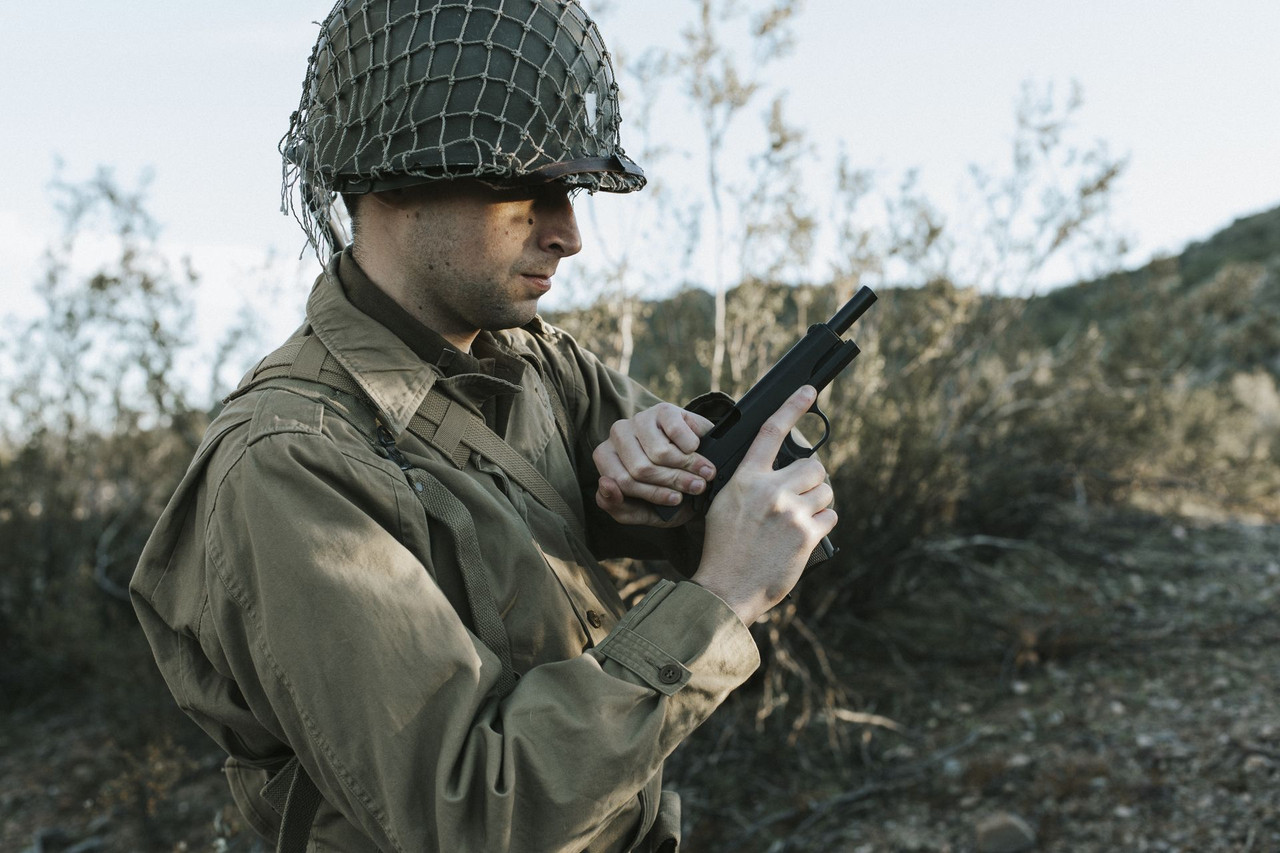 Lifestyle | 1911A1 US Army | checked in both hands by a soldier in WWII kit
