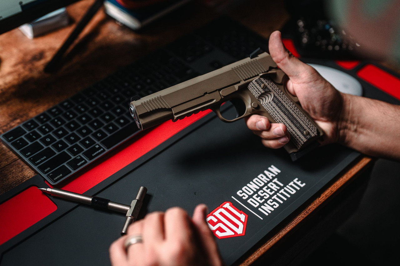 Lifestyle | 1911 Duty Raider | FDE held over the desk