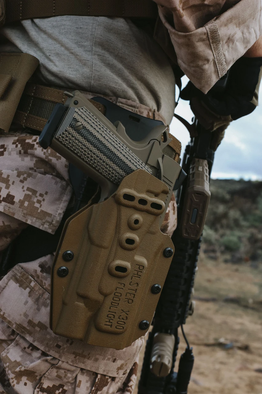 Lifestyle | 1911 Duty Raider | FDE in a Phlster holster on the carrier