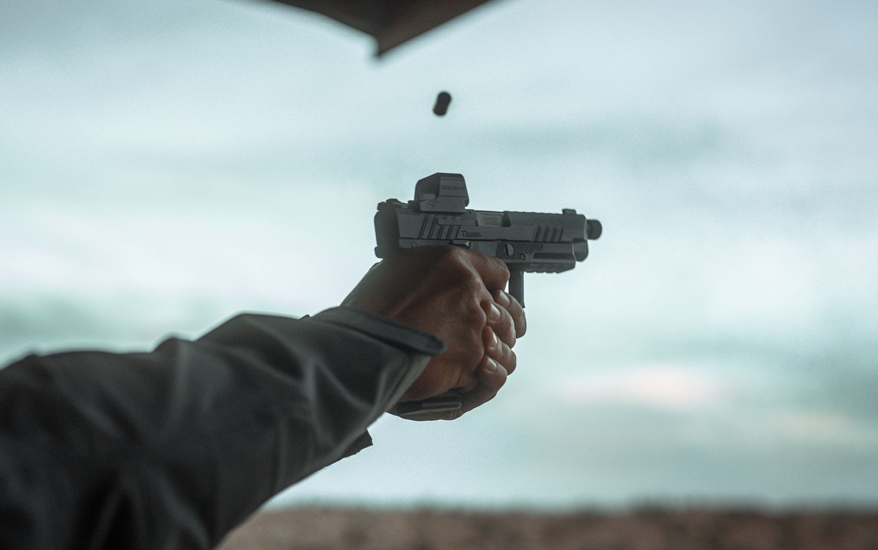Lifestyle | PX-9 | Tactical with a red dot, firing, case in the air