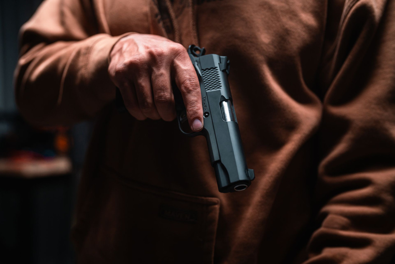 Lifestyle | 1911 Carry Stingray | held low against an orange hoodie