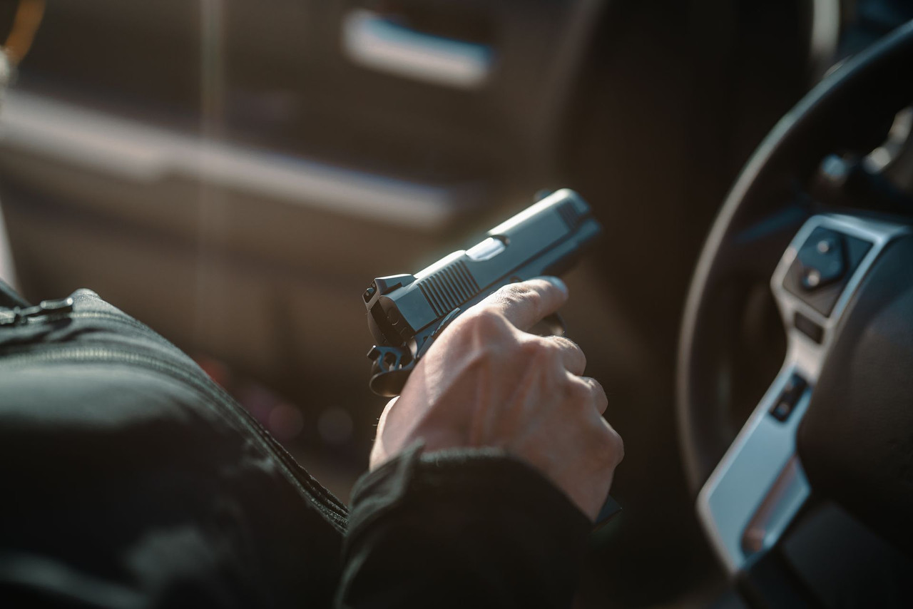 Lifestyle | 1911 Carry | black Carry in hand at the dash