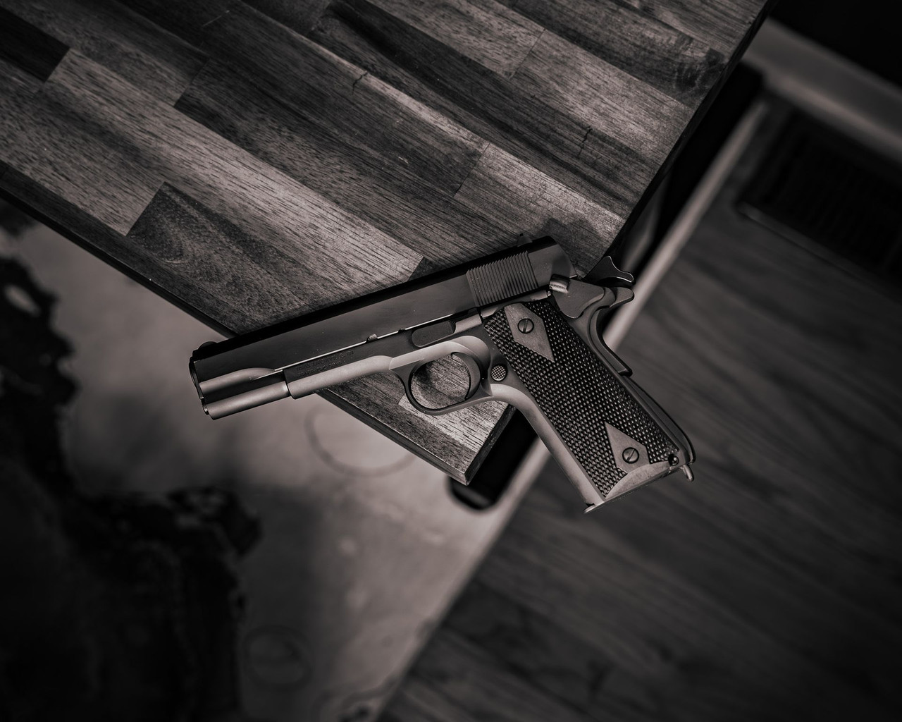 Lifestyle | 1911A1 Service | resting on a wood floor, black grips