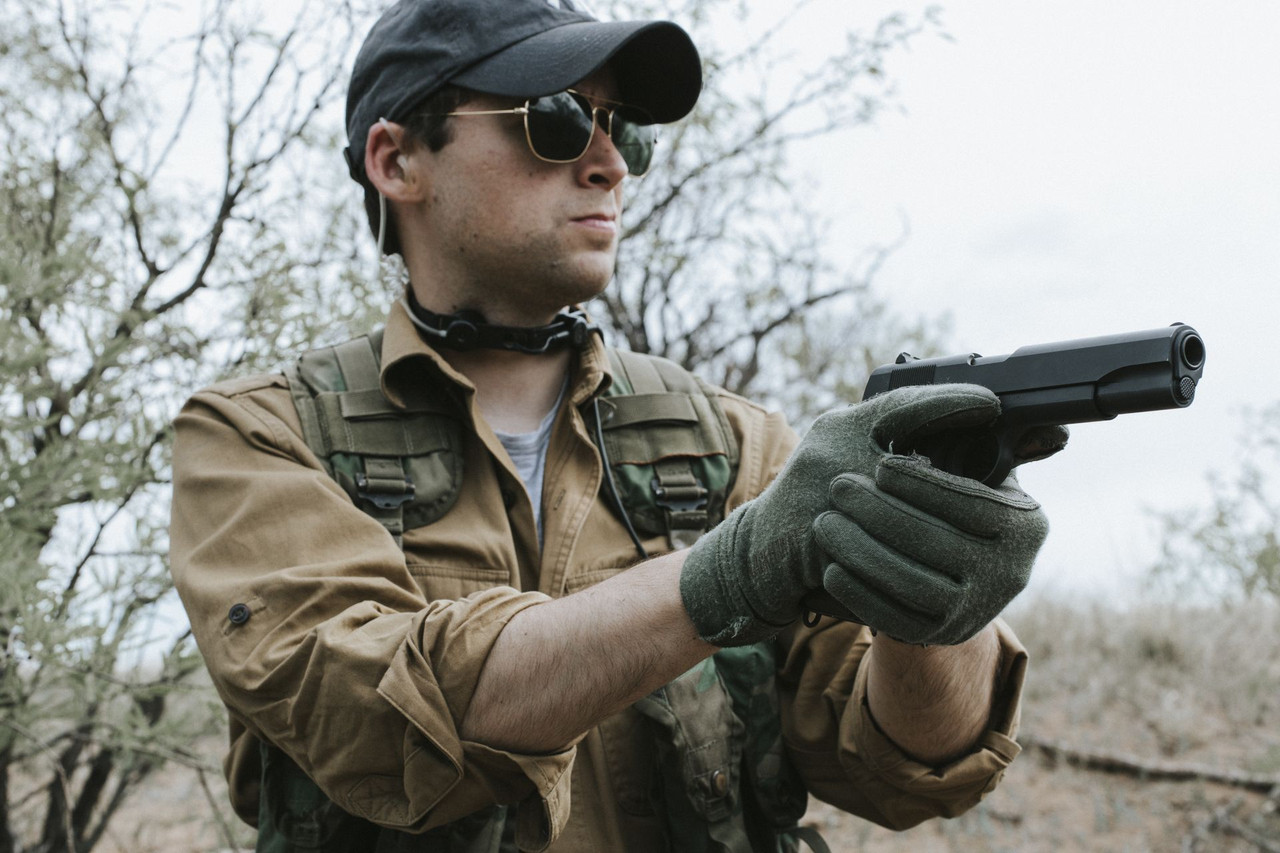 Lifestyle | 1911A1 Service | aimed right, gloved, desert scrub