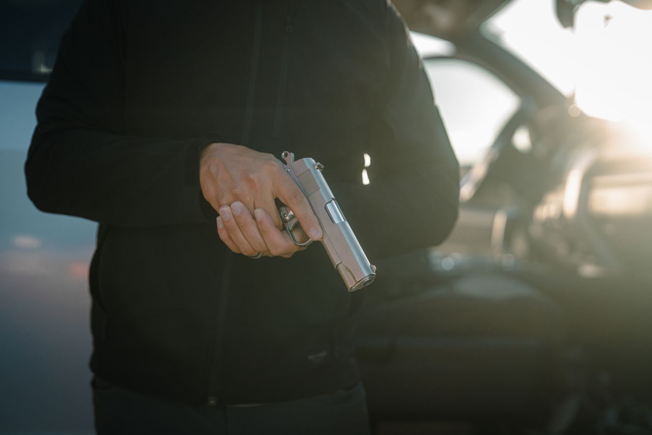 A polished Tisas 1911A1 Desperado on a dark surface