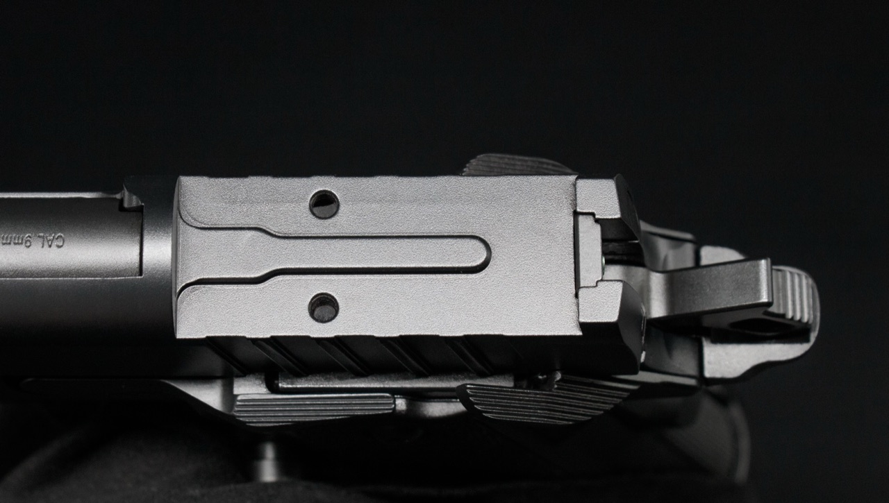Close-up of the milled AOS optic cut on a Tisas slide