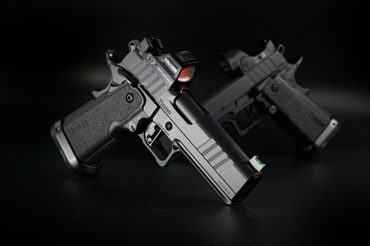 Two Tisas double stack pistols, one with a Holosun and one with a Trijicon red dot