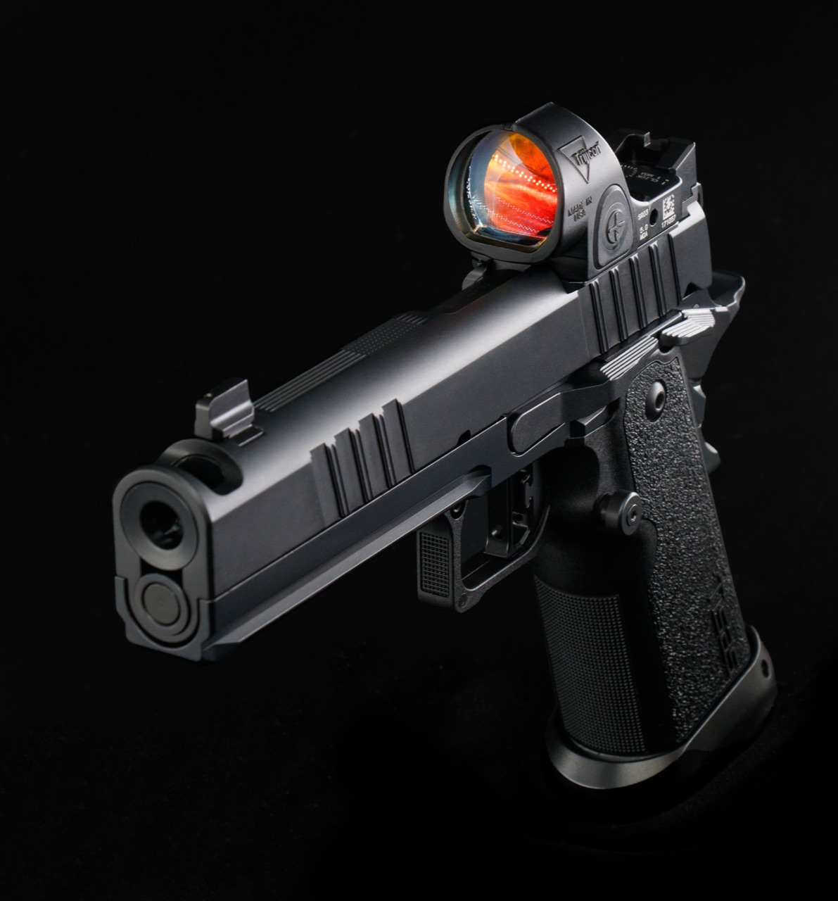 Tisas double stack 1911 with a Trijicon SRO red dot glowing over the rear sight
