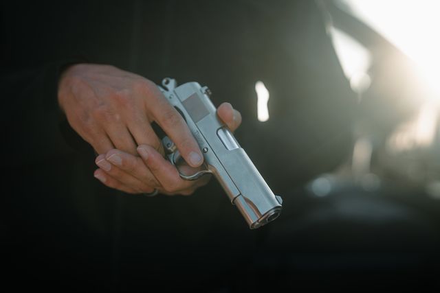 Tisas Desperado, polished chrome in hand close up