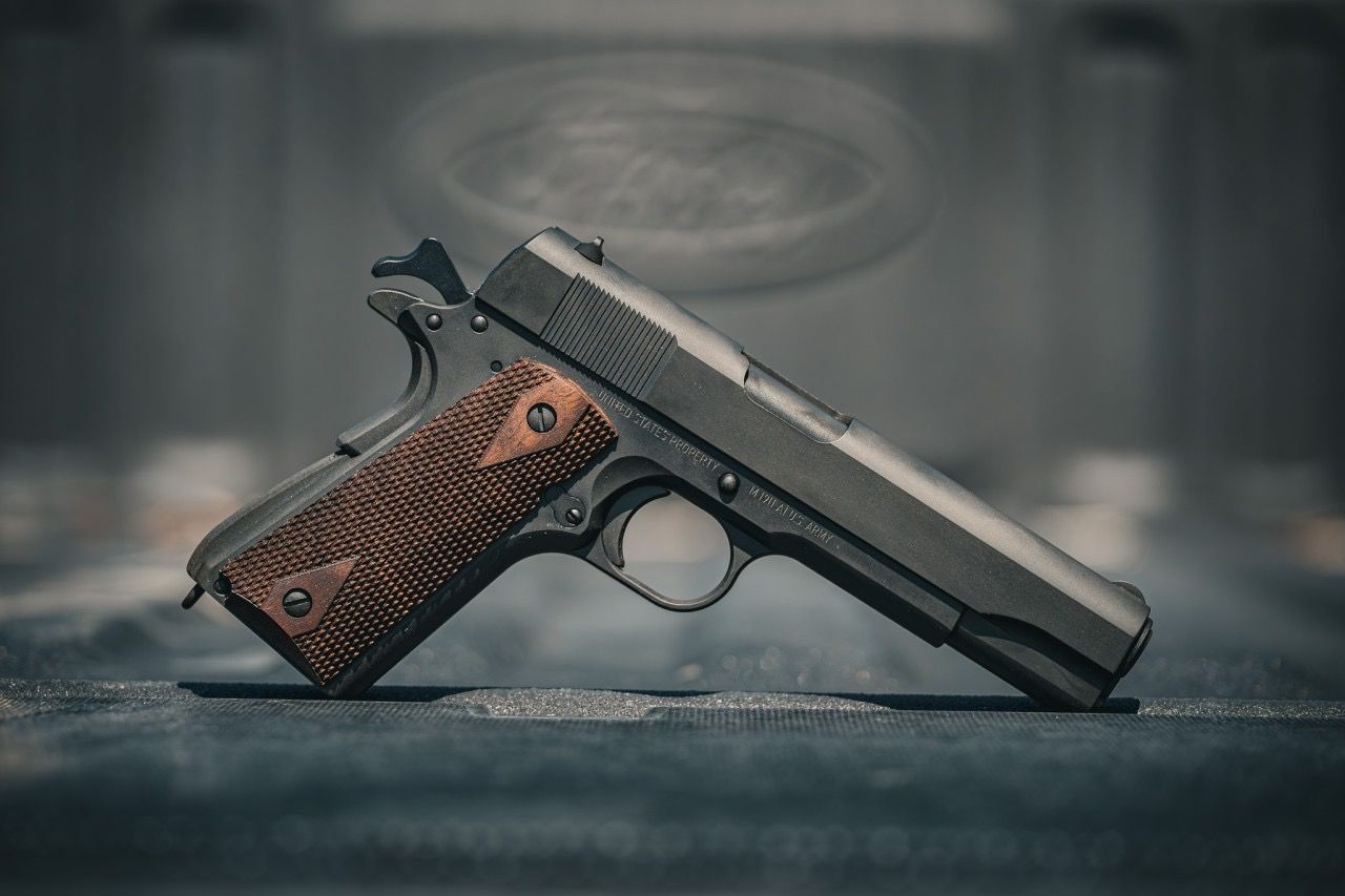 Left profile of a Tisas 1911A1 US Army with wood grips