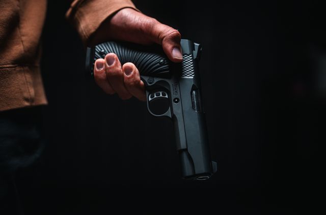 Tisas Stingray, held in low light, grip detail
