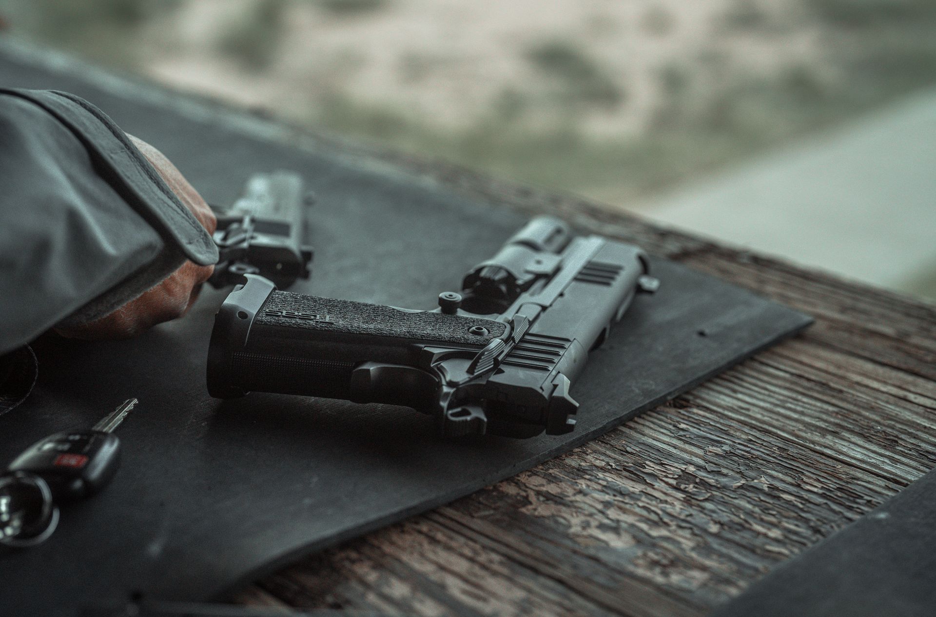 Tisas pistols staged on a range bench