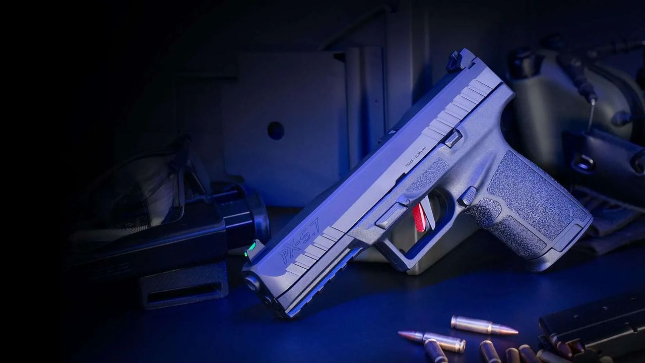 A Tisas PX-5.7 on a bench with 5.7x28mm ammunition and a spare magazine
