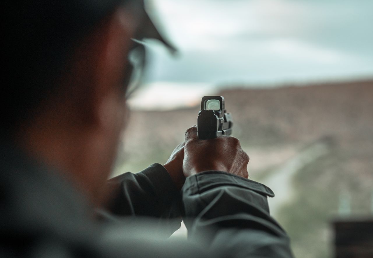 A Tisas PX pistol sighted in with a red dot optic mounted