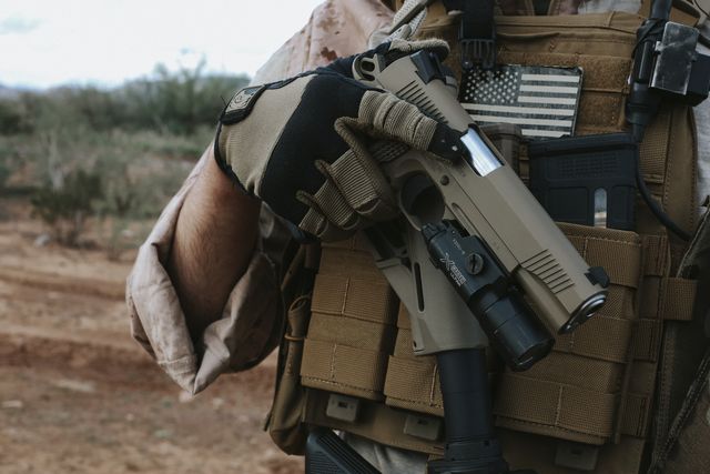Tisas Duty Raider, FDE with a light, drawn from the plate carrier