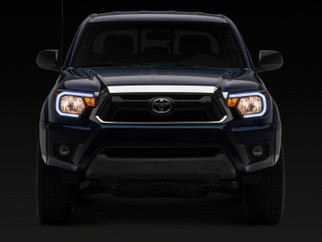 Raxiom 12-15 Toyota Tacoma Axial Series Headlights/Seq LED Bar- Black- Clear Lens