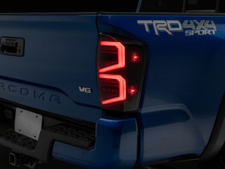 Raxiom 16-23 Toyota Tacoma ST LED Tail Lights- Black Housing- Smoked Lens