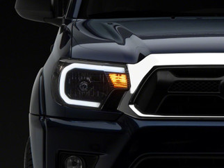 Raxiom 12-15 Toyota Tacoma Axial Series Headlights w/ LED Bar- Black Housing (Clear Lens)