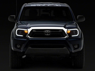 Raxiom 12-15 Toyota Tacoma Axial Series Headlights w/ LED Bar- Black Housing (Clear Lens)