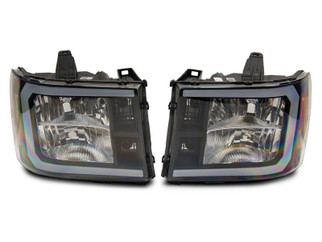 Raxiom 07-13 GMC Sierra 1500 Axial Series Headlights w/ LED Bar- Black Housing (Clear Lens)
