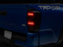 Raxiom 16-23 Toyota Tacoma ST LED Tail Lights- Black Housing- Smoked Lens