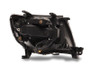 Raxiom 05-11 Toyota Tacoma Axial Series Switchback Projector Headlights- Black Housing- Clear Lens