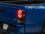 Raxiom 16-23 Toyota Tacoma XW Series Sequential LED Tail Lights- Black Housing- Clear Lens