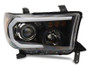 Raxiom 07-13 Toyota Tundra Axial Projector Headlights w/ SEQL LED Bar- Black Housing (Clear Lens)