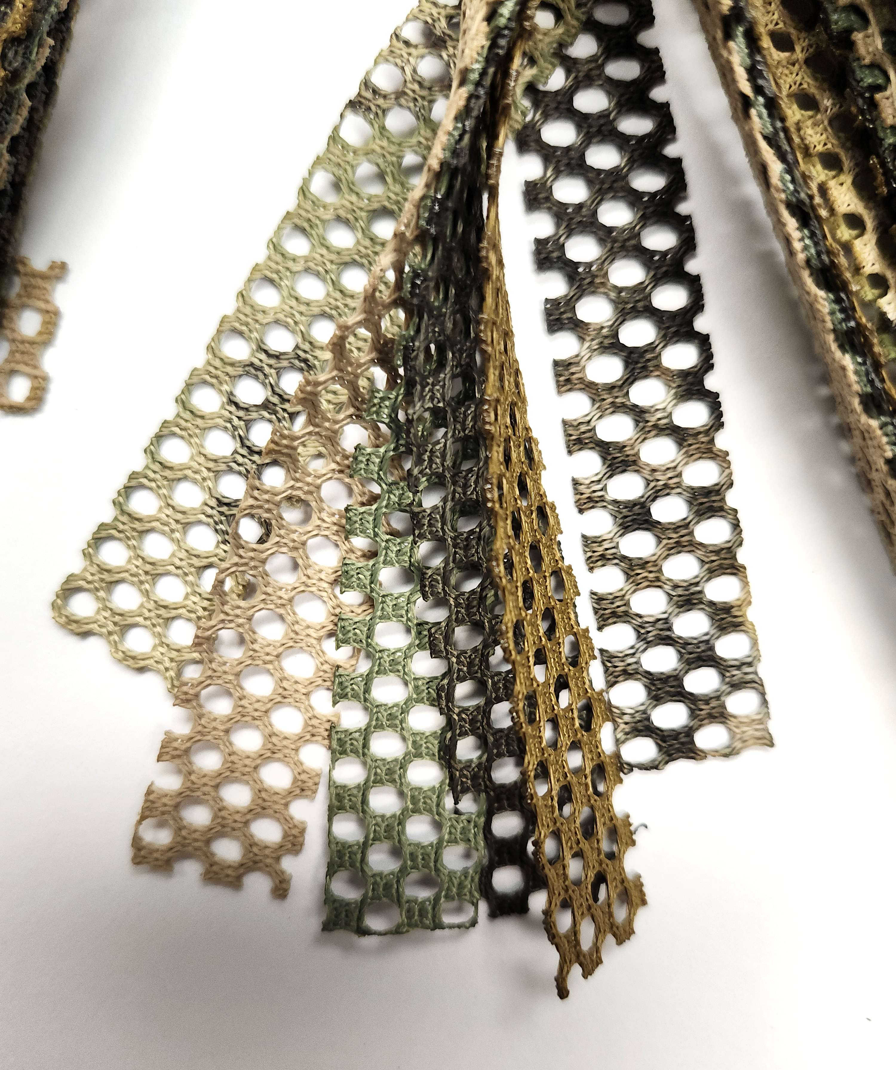 Close up of the tip of Bonnie Garnish bundle over a white background.