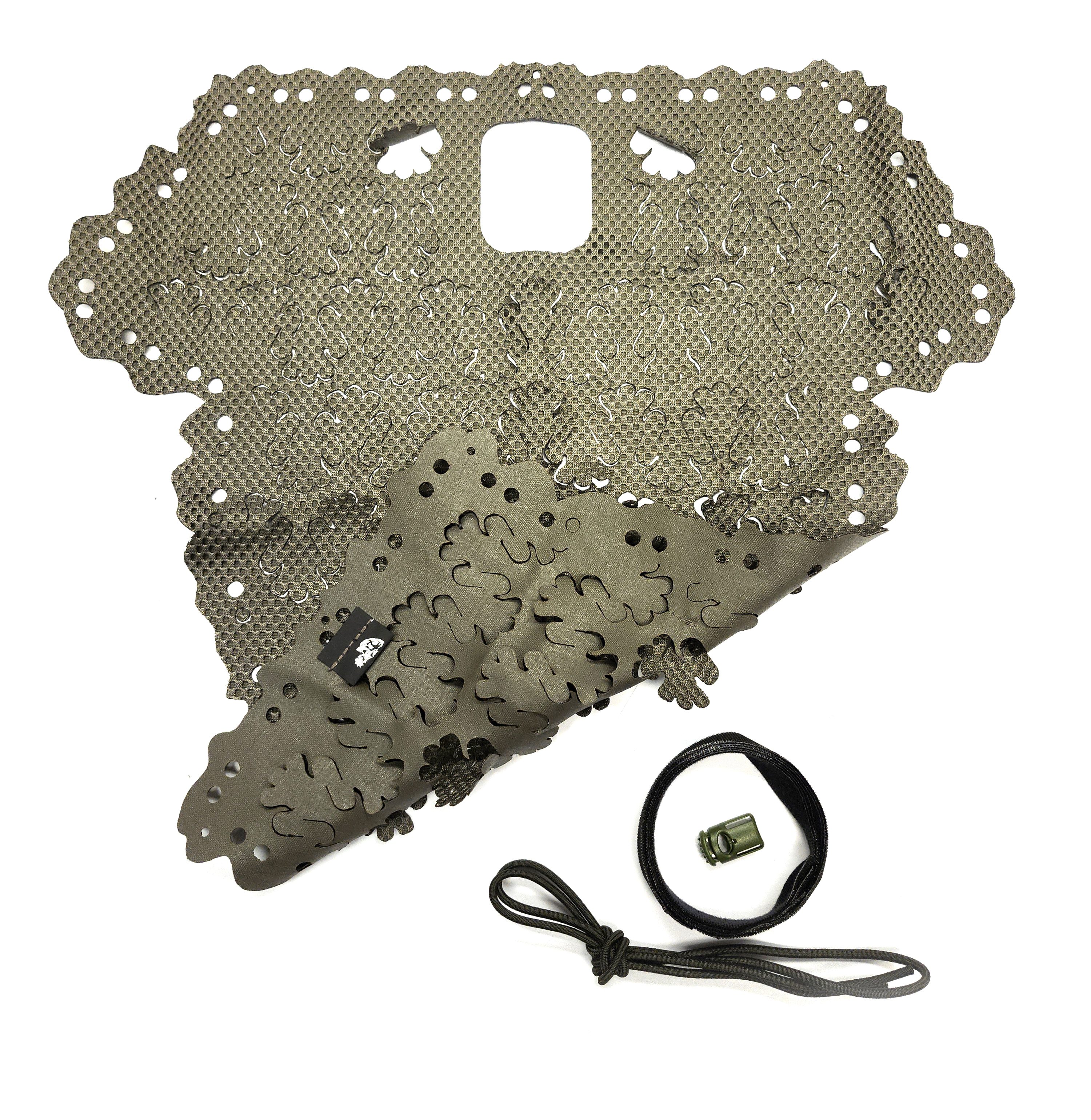 Carcajou Tactical helmet scrim laid flat showing both sides in Ranger Green with included bungee cord and ITW cord lock