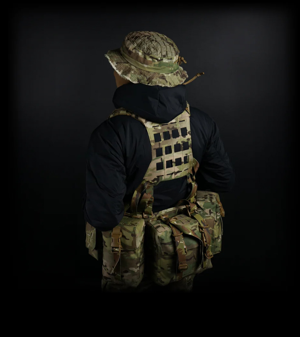 Rear view of operator wearing Carcajou sniper boonie hat in Multicam with mesh camouflage netting, available at Hudson Supplies Corp USA.