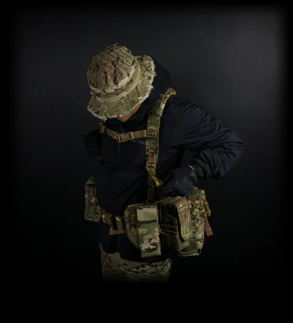 Sniper boonie hat in Multicam with mesh camouflage netting, worn with tactical gear, available at Hudson Supplies Corp USA.