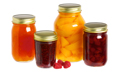 Canning jars filled with fruit and preserves