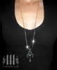 moorish marquise silver cross necklace with green peridot stones renaissance gothic medieval jewelry model wearing 30" silver snake chain