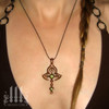 Model wearing Bronze Moorish Princess Cross Necklace | Historic Gothic Pendant with green peridot Semi Precious Stones. and box chain choker