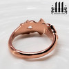 rose gold ring over bronze back view, tiny princess promise ring, pink metal