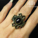 empress vampire brass ring with black onyx cabochon on middle finger