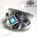 silver medieval wedding ring with gothic blue topaz stones