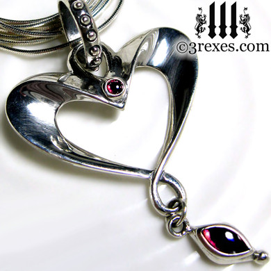 eros heart necklace long snake chain with gothic garnet cabochon