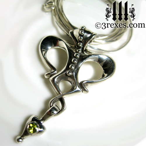 queen of hearts gothic crown necklace with green peridot stone