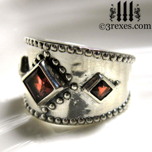 silver medieval ring with gothic light to medium garnet stones