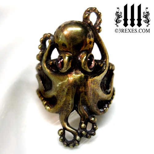 bronze octopus ring with garnet cabochon eyes