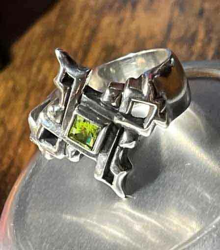 silver cross ring with cathedral look and green stone